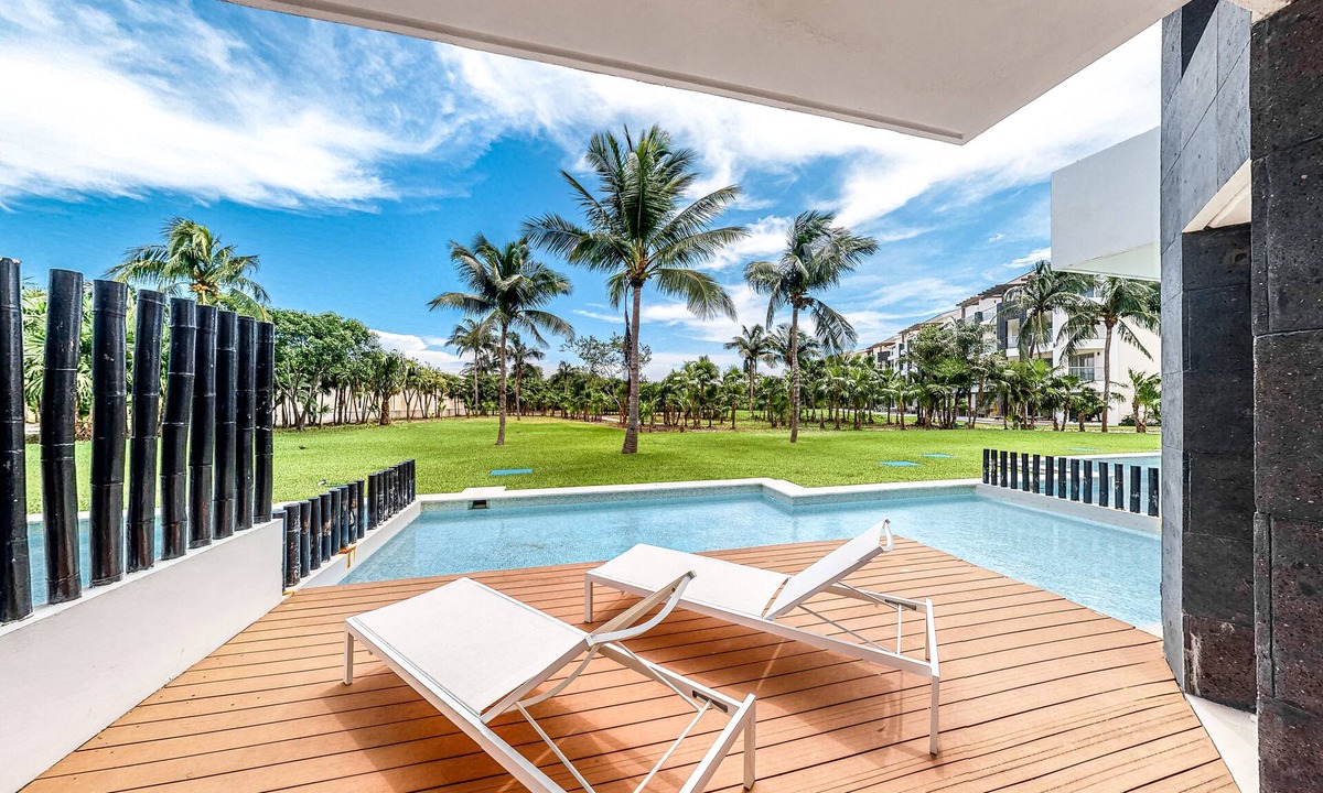 Ejidal Condo | Elegant condo with a private pool, deck, hammock, free WiFi, and central AC