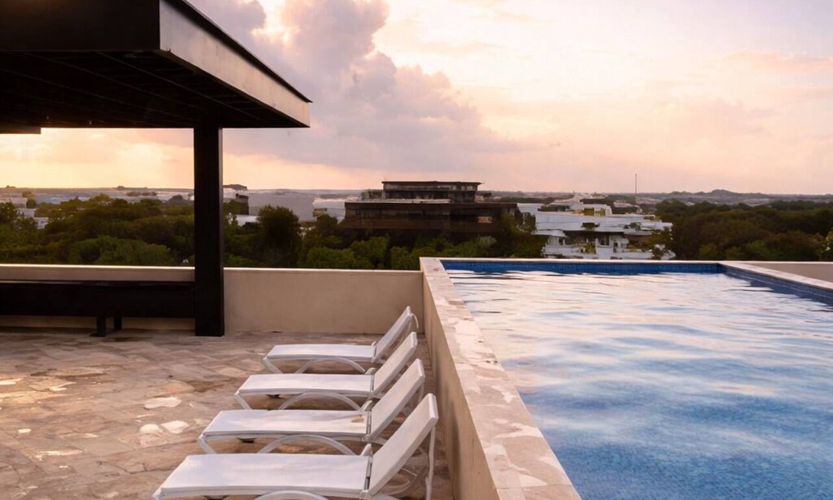 Tulum Condo | Escape to Giada Towers, Aldea Zama: 2-bedroom, 2-bathroom apartment with a private jacuzzi on the main terrace and a large L-shaped terrace with a grill and direct access to the pool. Includes 2 bicycles and access to the gym, movie theater, and ck