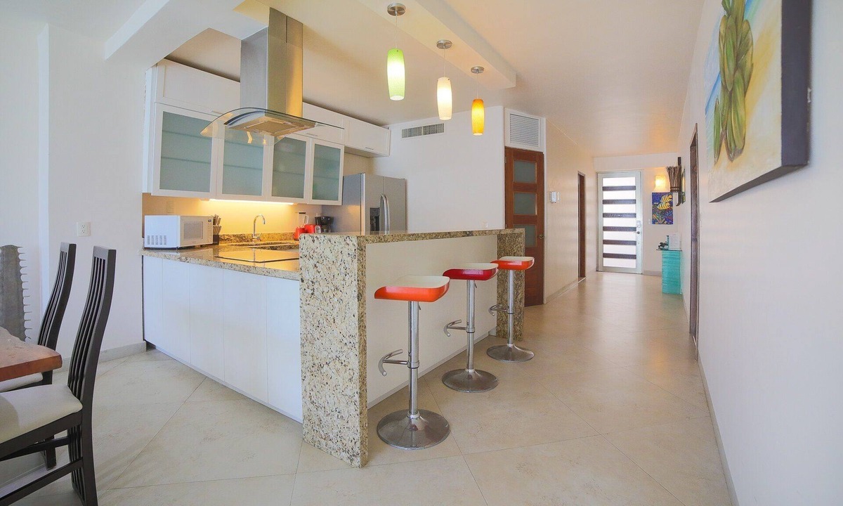 Gonzalo Guerrero Condo | Large, modern condo with balcony overlooking 5th Ave. 4 minute walk to the beach