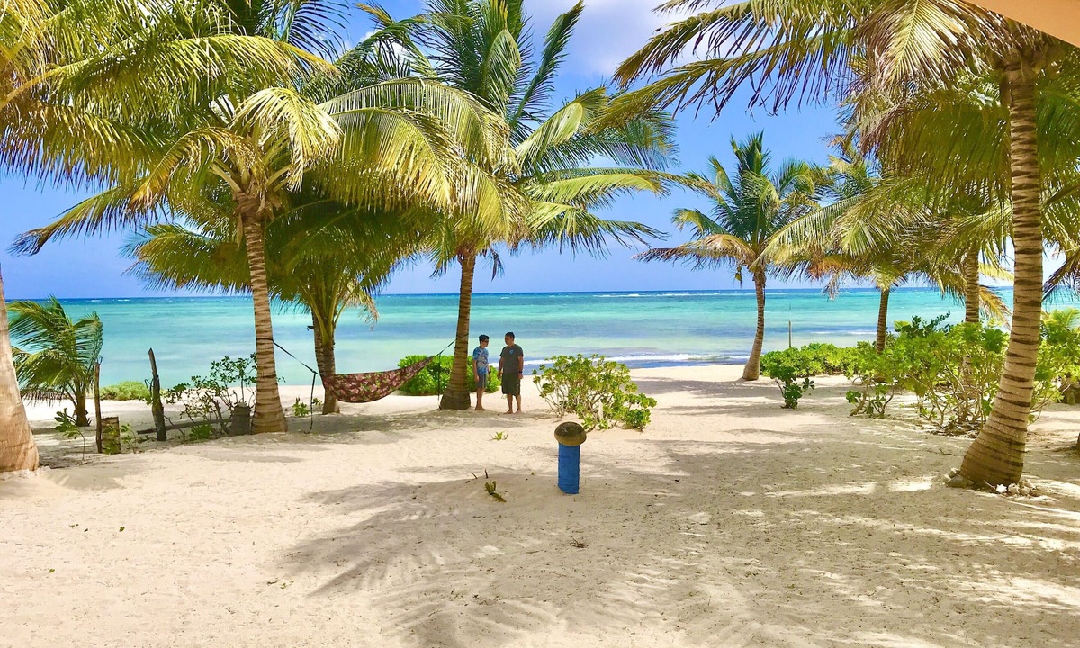 Majahual House | Spacious oceanfront home with palm trees, kayaks and spectacular views!