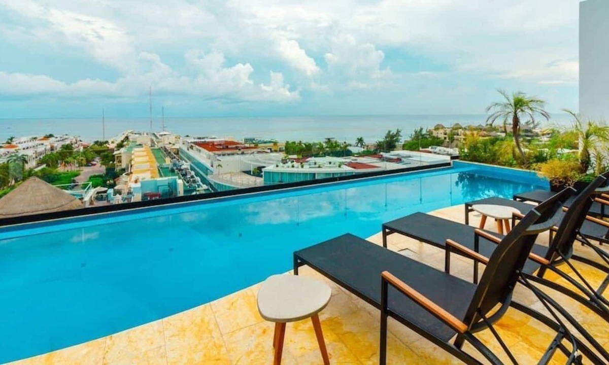 12th Street Apartment | Studio with AC Kitchen Pool Gym and Rooftop view