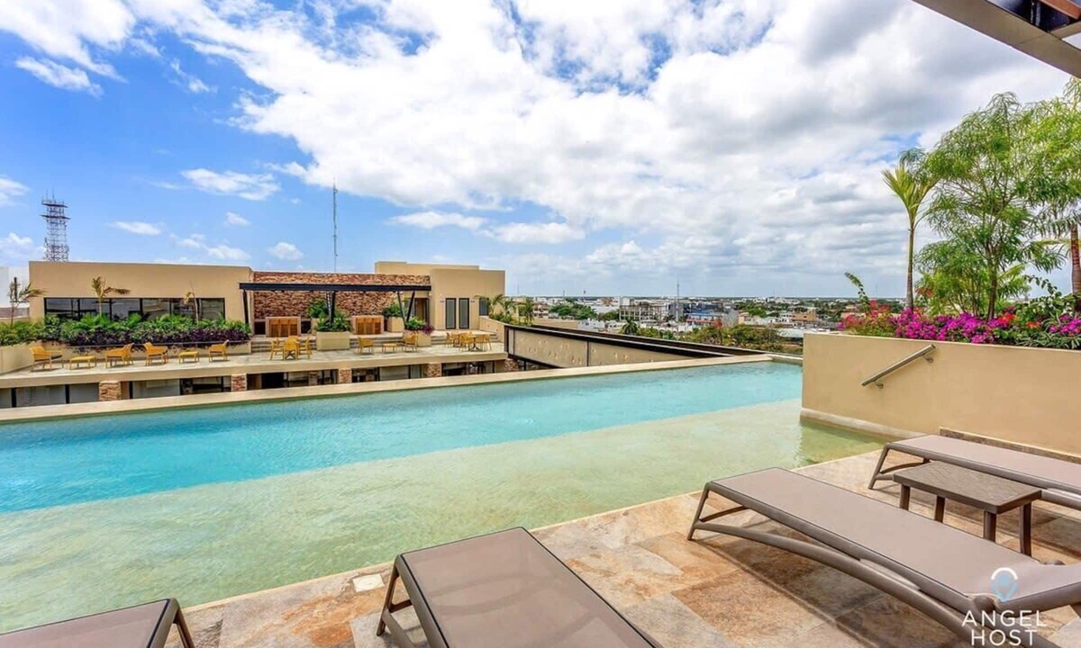 Centro Apartment | Stylish Playa Condo: Rooftop Pool, Gym, Near Beach