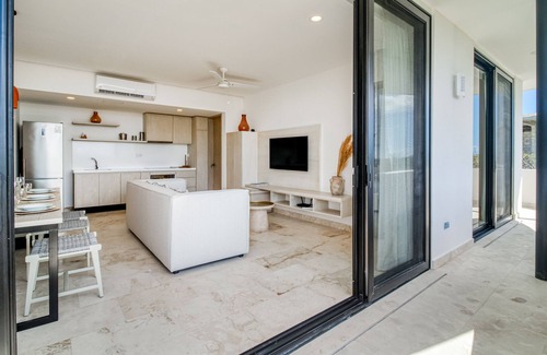 Zama Apartment | Beautiful apartment with rooftop pool, fitness area, & balcony