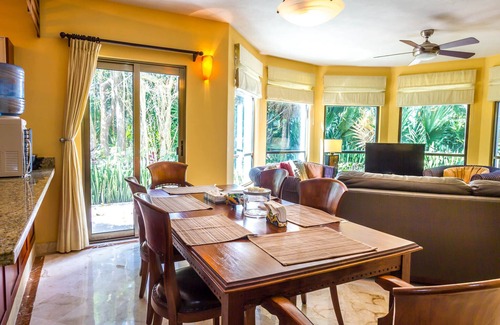 Playacar Condo | Beautiful Garden floor condo with pool views in Paseo del Sol by BRIC