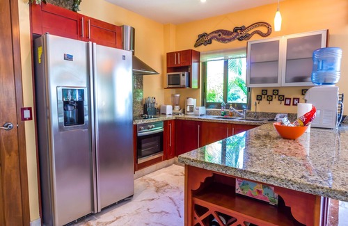 Playacar Condo | Beautiful Garden floor condo with pool views in Paseo del Sol by BRIC