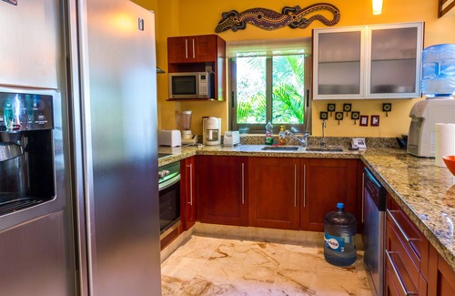 Playacar Condo | Beautiful Garden floor condo with pool views in Paseo del Sol by BRIC