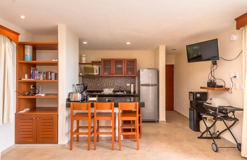 Akumal Condo | Charming, romantic beachfront studio with a king bed, AC and maid service.