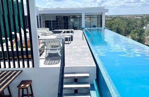 Zama Apartment | Fresh and Stylish Studio Aldea Zama rooftop pool Mya 109