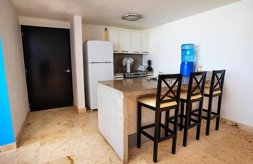 Puerto Juarez Condo | Ground Floor Unit with Views of the gardens and pool at The Elements by BRIC