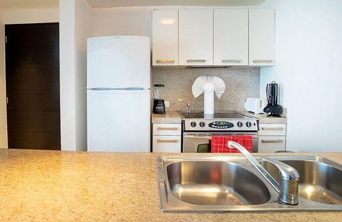 Puerto Juarez Condo | Ground Floor Unit with Views of the gardens and pool at The Elements by BRIC