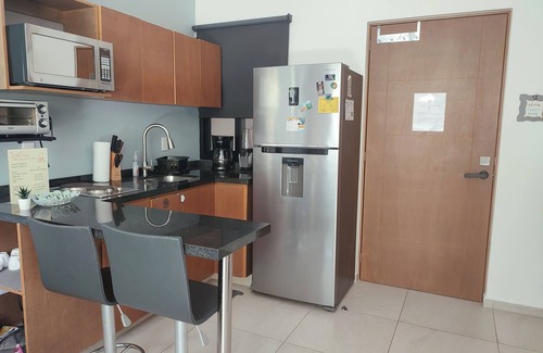 Puerto Morelos Condo | Modern 1-BR, close to beach, restaurants & supermarket. King bed & private patio