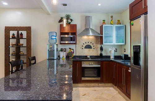Playacar Fase I Condo | Second Floor Unit with views of the gardens and pool at Paseo del Sol by BRIC
