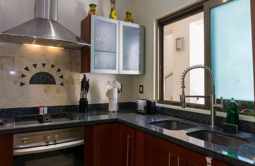 Playacar Fase I Condo | Second Floor Unit with views of the gardens and pool at Paseo del Sol by BRIC