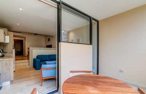 Centro Apartment | Stylish Playa Condo: Rooftop Pool, Gym, Near Beach