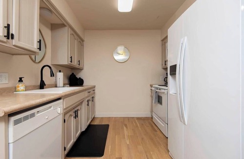 Brookline Station Apartment | 2 Bedroom Quiet Retreat + Garage & Fenced Yard