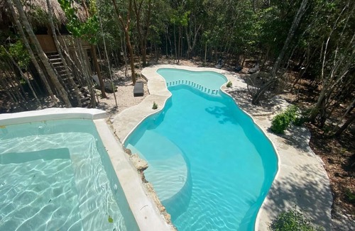 Puerto Morelos Hotel | Aldea Maya-Ha Cabañas con cenotes