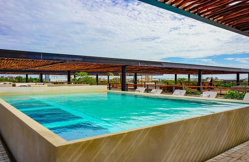 Zama Condo | Aldea Zama District apartment with rooftop pool, deck, & fitness center