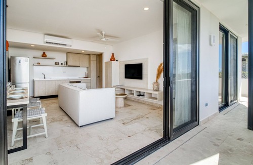 Zama Apartment | Beautiful apartment with rooftop pool, fitness area, & balcony
