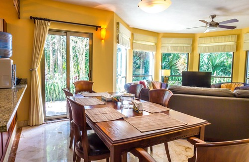 Playacar Condo | Beautiful Garden floor condo with pool views in Paseo del Sol by BRIC
