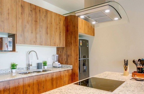 Puerto Juarez Condo | Bright & Cheerful Condo + Pool, Gym & Playground!