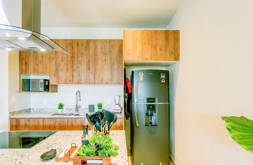 Puerto Juarez Condo | Bright & Cheerful Condo + Pool, Gym & Playground!