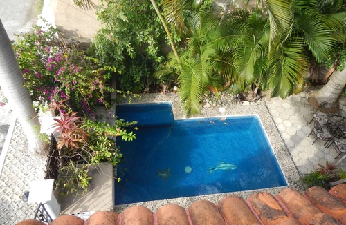 Colonos Cuzamil House | CASA OKLAHOMA in Cozumel Mexico is beautiful, private oasis 3 blocks from Ocean.