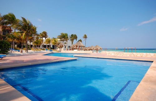 Akumal Condo | Charming, romantic beachfront studio with a king bed, AC and maid service.