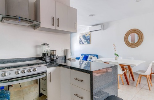 Puerto Juarez Apartment | Comfortable Family Retreat: Pool, BBQ & Playground