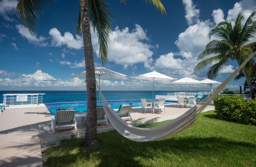 Zona Hotelera Norte Condo | Condo 101, Swimming pool level oceanfront condo, Pristine grounds and pool!
