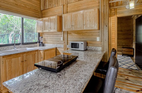 Tulum Cabin | Eco-luxe jungle cabin with furnished patio, lanai, partial AC, & on-site cafe