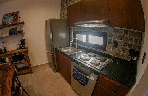 Mario Villanueva Madrid Condo | Elegant 2-Bedroom 2-Bath Retreat with Rooftop Oasis & Pool