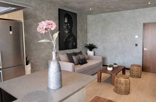 Tulum Condo | Enjoy Tulum from this comfortable 1BR apartment at TUK TULUM, ideal for up to 4 guests. It features a king bed, queen sofa bed, fully equipped kitchen, private balcony, and access to rooftop pools, paddle tennis courts, parking, and 24/7 security.