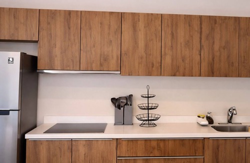 Tulum Condo | Escape to Giada Towers, Aldea Zama: 2-bedroom, 2-bathroom apartment with a private jacuzzi on the main terrace and a large L-shaped terrace with a grill and direct access to the pool. Includes 2 bicycles and access to the gym, movie theater, and ck