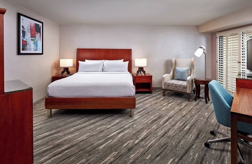 Valencia Hotel | Grand Balcony King Room | Overlooking Pool & Courtyard | On-Site Dining