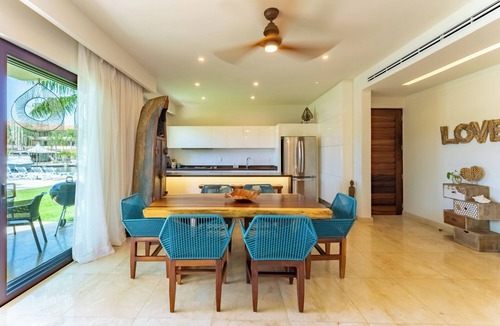 Puerto Aventuras Apartment | Ground Floor Marina Apartment with Pool Terrace and Paddleboard Puerto Aventuras