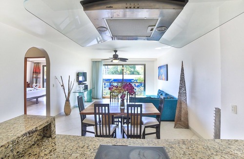 Gonzalo Guerrero Condo | Large, modern condo with balcony overlooking 5th Ave. 4 minute walk to the beach