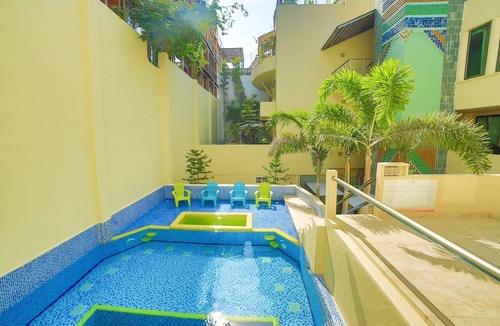 Gonzalo Guerrero Condo | Large, modern condo with balcony overlooking 5th Ave. 4 minute walk to the beach