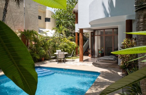 Puerto Morelos Apartment | Large studio with king bed, full kitchen, sofa bed. Half wall separating.