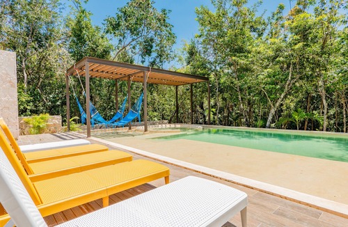 Xpu-Ha Apartment | Lower level apartment with high-speed internet pool, gym, & tennis courts
