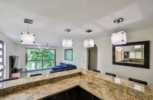 Gonzalo Guerrero Condo | Luxury 1 bed Condo w/ Large Private Patio On 5th Ave. Steps to Beach! Fast Wifi!