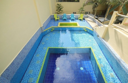 Gonzalo Guerrero Condo | Luxury 1 bed Condo w/ Large Private Patio On 5th Ave. Steps to Beach! Fast Wifi!