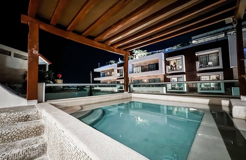 Downtown Apartment | MAGIC PARADISE MAMITAS BEACH AREA, Partial Ocean View from rooftop