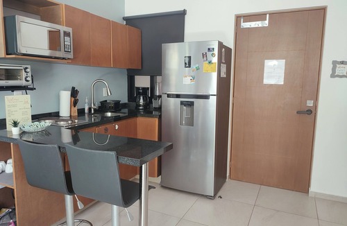 Puerto Morelos Condo | Modern 1-BR, close to beach, restaurants & supermarket. King bed & private patio