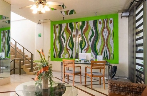 Gonzalo Guerrero Condo | Modern condo with patio and balcony overlooking 5th Ave. 4 minute walk to beach!