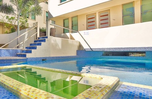 Gonzalo Guerrero Condo | Modern condo with patio and balcony overlooking 5th Ave. 4 minute walk to beach!