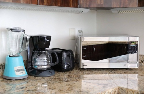 Gonzalo Guerrero Condo | Modern Condo w/ Large Private Patio on 5th Avenue. 4 min. Walk to the Beach!