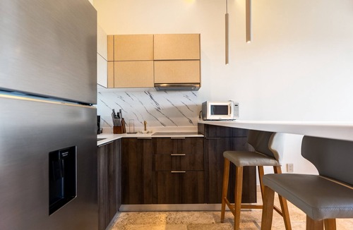 Playa Paraiso Condo | Modern condo with rooftop infinity pool, hot tub, jetted hot tub & WiFi