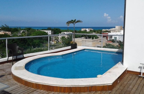Luis Donaldo Colosio Condo | Ocean view condo with rooftop pool near the beach