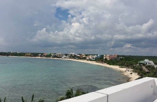Akumal Condo | Oceanfront double size beach condo in La Sirena condominium