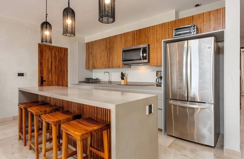 Tulsayab Apartment | Oceanfront Dreams: Immerse yourself in unforgettable sunrises in front of the Caribbean.